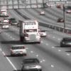 Vehicle Segmentation and Tracking from a Low-Angle Off-Axis Camera